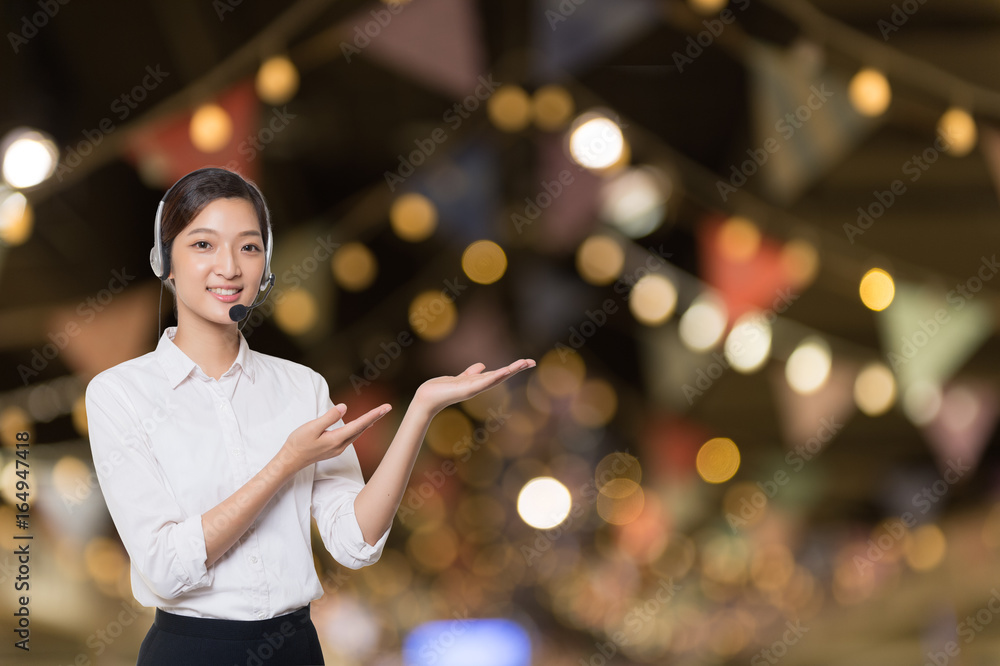 Fototapeta premium Asian woman pointing side