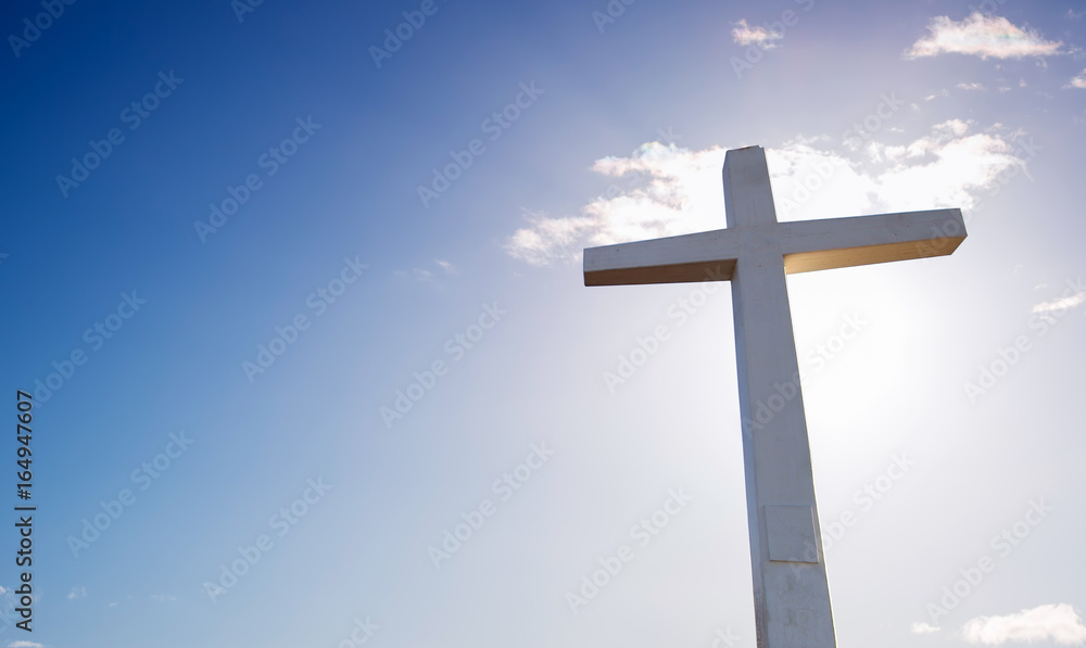 Cross over bright sky background Cross over bright sky background