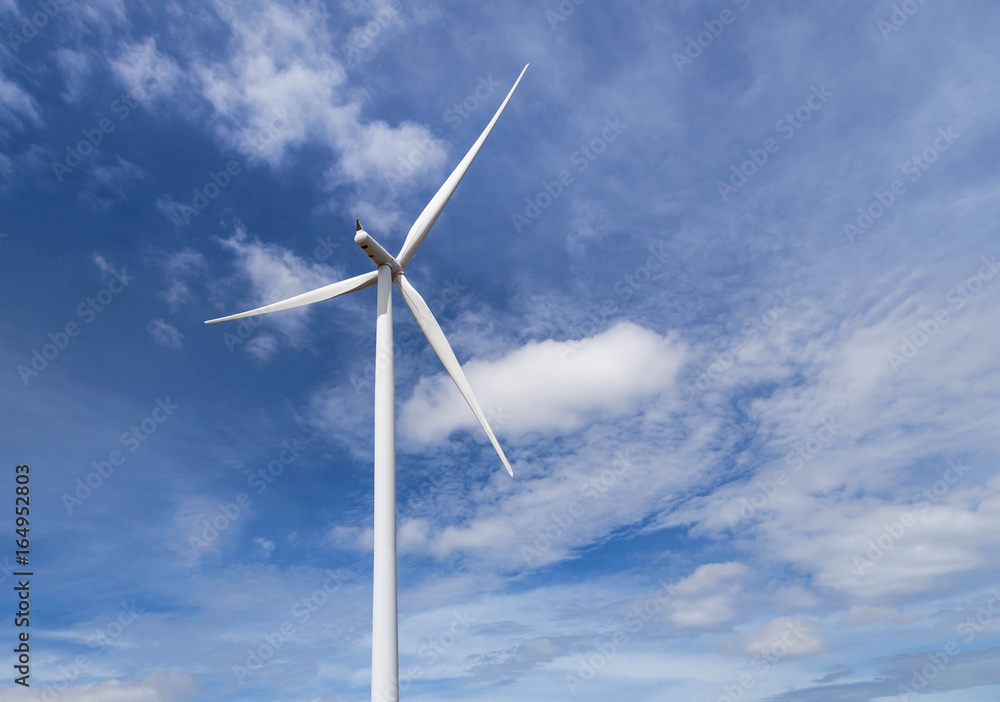 white wind turbines generating electricity in wind power station under blue sky background white wind turbines generating electricity in wind power station under blue sky background