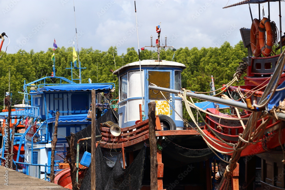 Colorful Fishing Boat dock at village pier in canal river