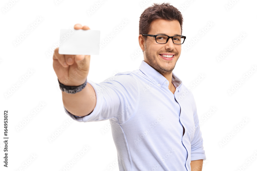 Young man showing a blank business card Young man showing a blank business card