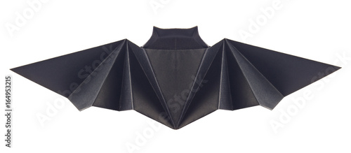 Black bat of origami, isolated on white background. Stock photo.
