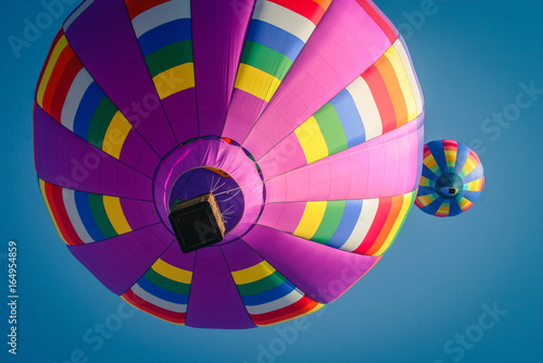 Fototapeta Naklejka Na Ścianę i Meble -  Hot Air Balloons from Below on a Summer Afternoon