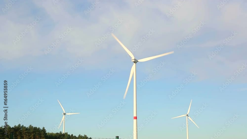 Windmill propellers spinning. Green energy generation. Windmill propellers spinning. Green energy generation.