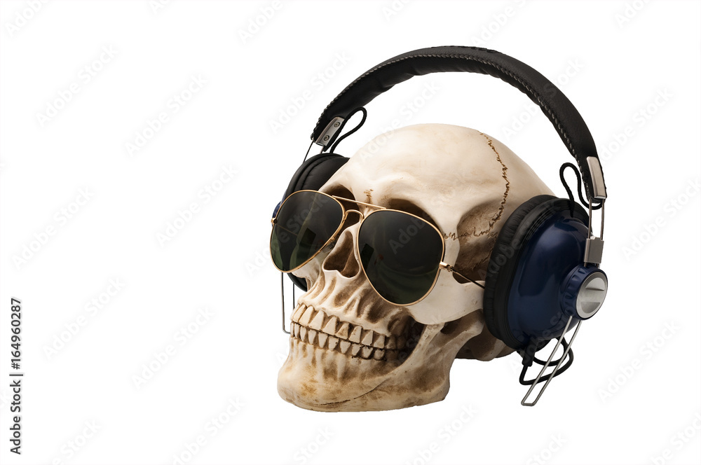 Fototapeta premium Music Dj and rock music concept with a skull wearing headphones and aviator sunglasses isolated on white with clipping path