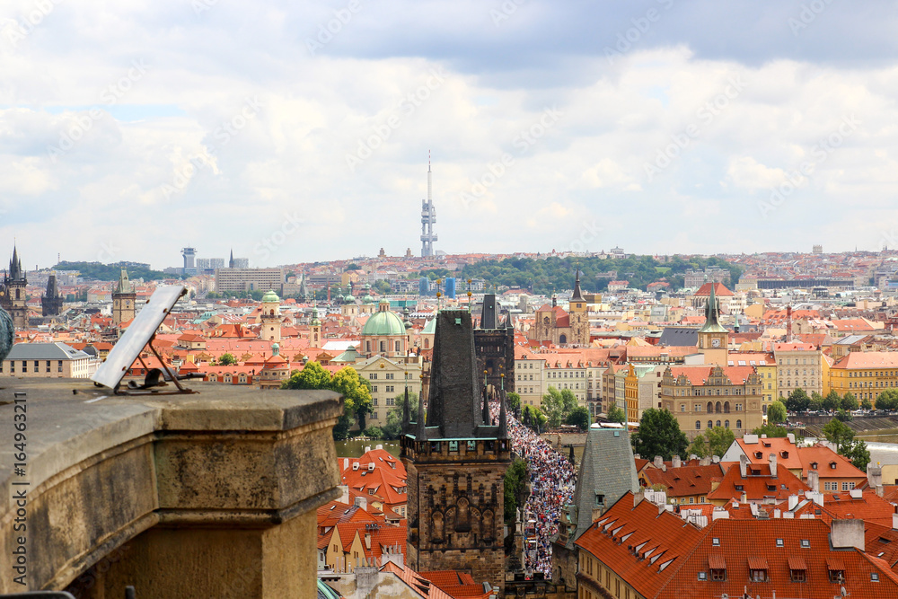 Fototapeta premium Panorama of Prague view of Charles bridge, on the bridge a crowd of people