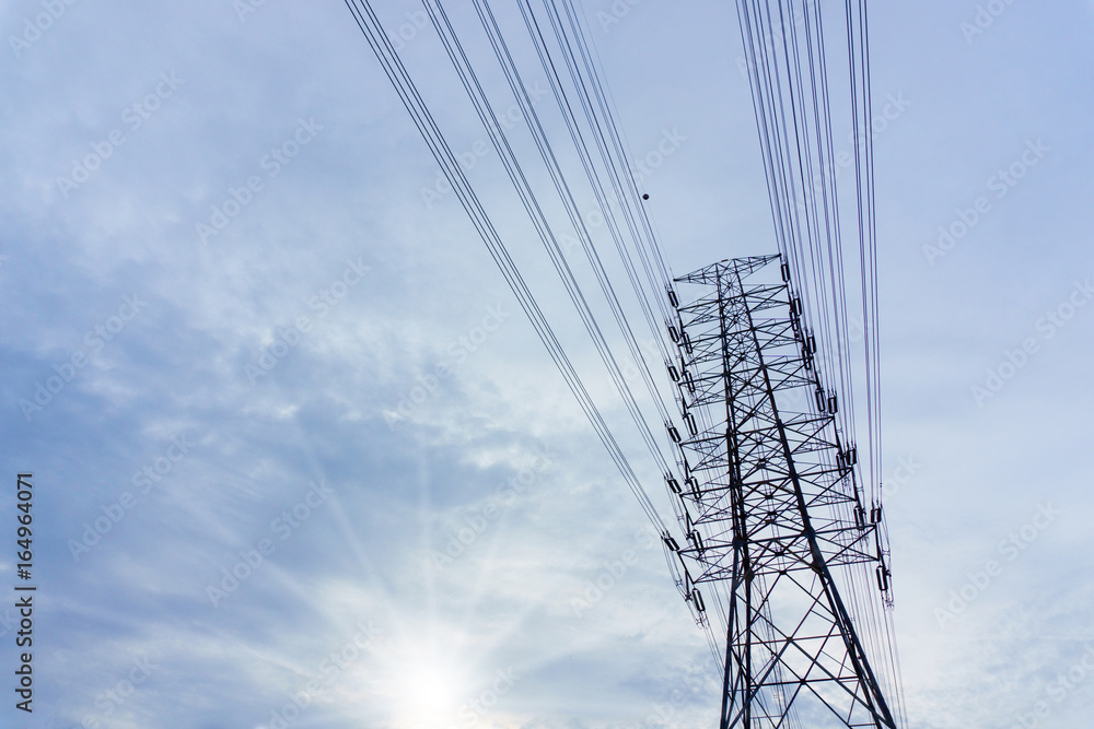 electricity transmission pylon with blue sky and cloud when sunset. electricity transmission pylon with blue sky and cloud when sunset.