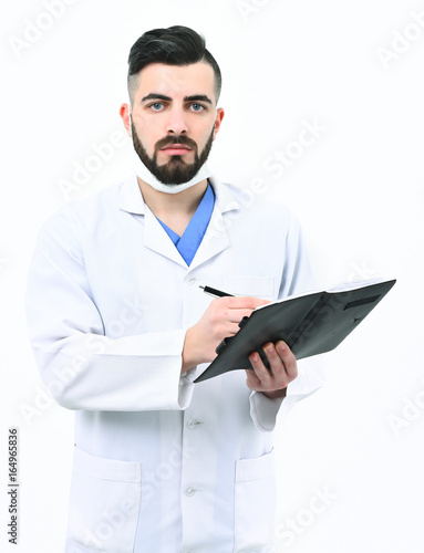 Man with concentrated face in white coat and surgical mask