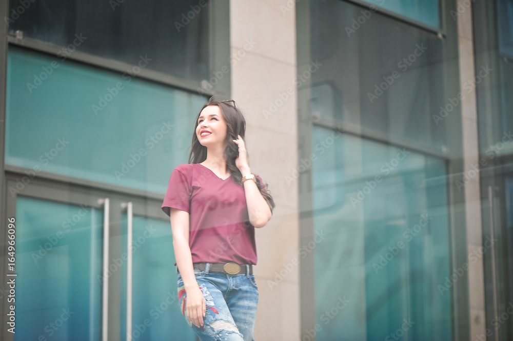 Outdoor lifestyle hipster teen girl posing alone at city center