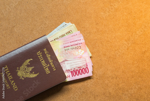 Thailand passport with asian money