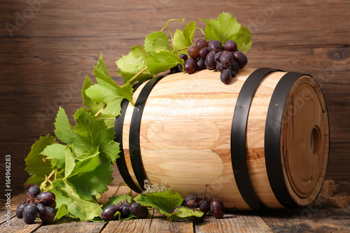 wooden barrel with grape and leaf