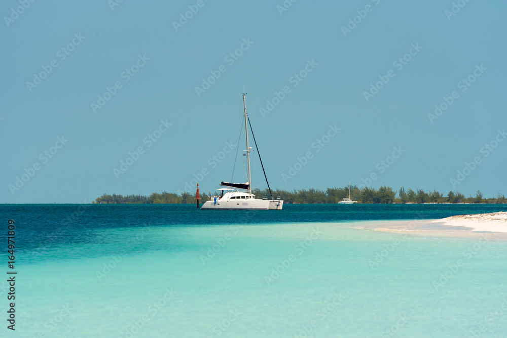 Yacht at the beach Playa Paradise of the island of Cayo Largo, Cuba. Copy space for text.