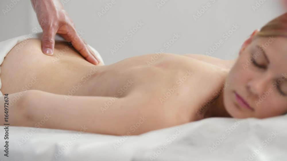Pretty young woman receiving acupressure massage at spa Pretty young woman receiving acupressure massage at spa