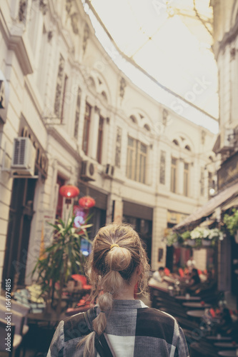 Girl walking on old streets of Bucharest. Romania. Europe. Traveler. City Brake