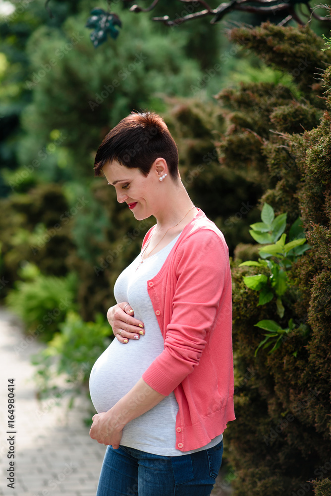 Beautiful pregnant girl walks in the Park. Beautiful pregnant girl walks in the Park.