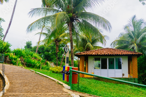 Pedestrian walkway with guardhouse in a tropical park