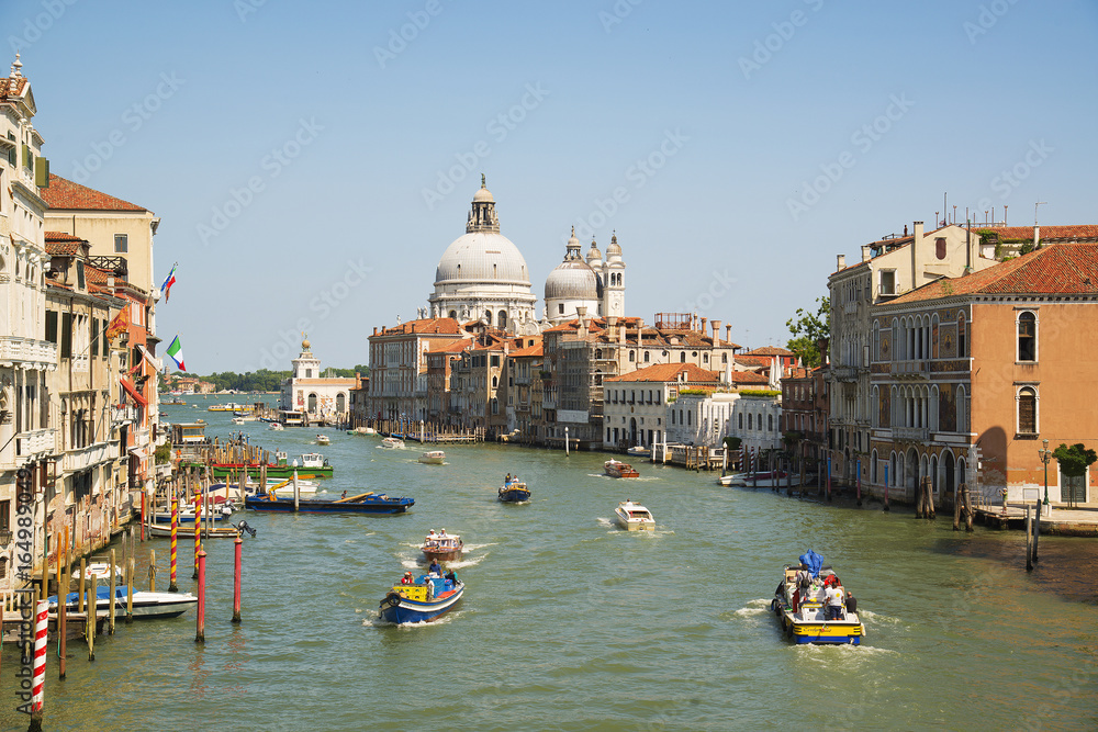 Fototapeta premium The Grand Canal and the Basilica of Santa Maria della Salute, Venice, Italy - June 20, 2017.