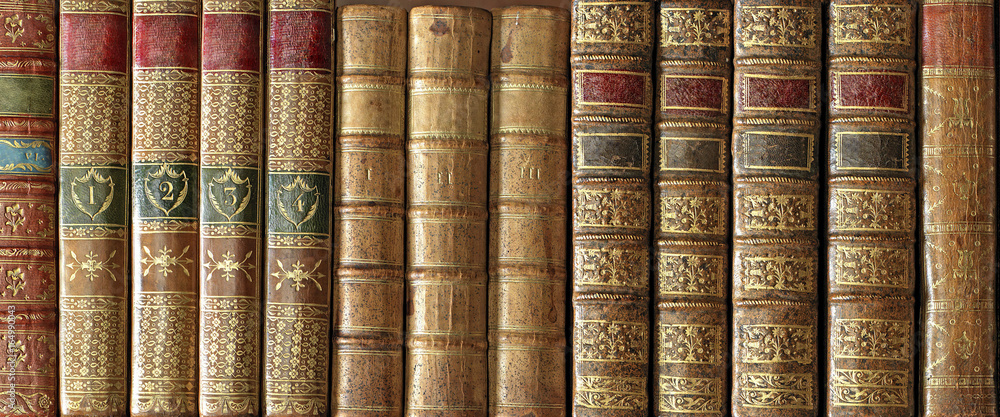 Old books on a bookshelf with beautiful spines Old books on a bookshelf with beautiful spines