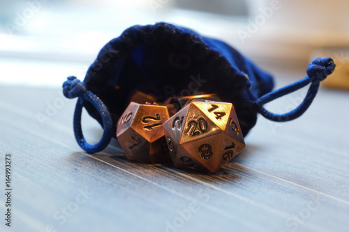 A set of polyhedral dice with a draw string bag