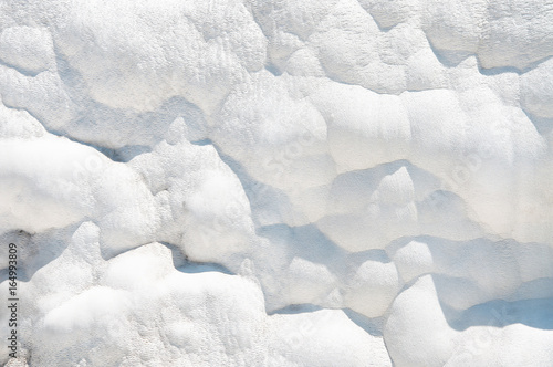 White mineral surface background. Pamukkale travertines. Thermal springs.