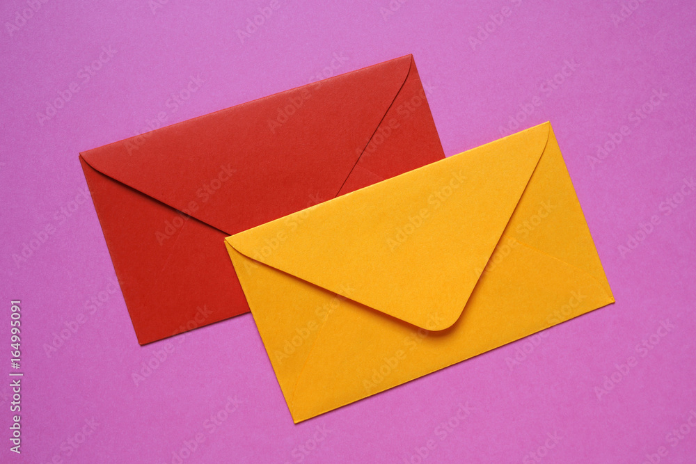 red and orange envelopes on pink background red and orange envelopes on pink background