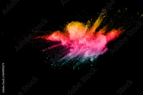 abstract color powder explosion on black background.abstract color powder splatted on black background. Freeze motion of color powder exploding.