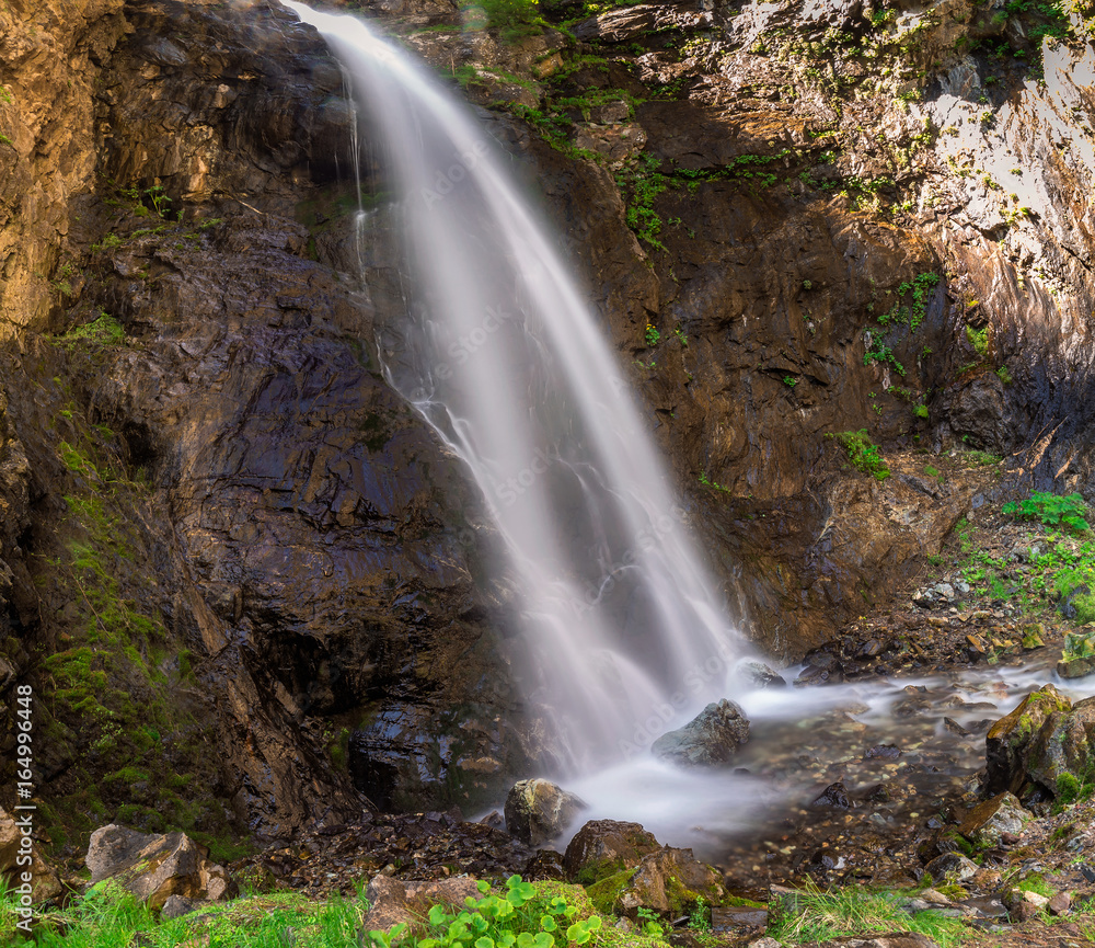 Natural famous landmark Gveleti big waterfalls in the Darial gorge in Kazbegi, Georgia.
