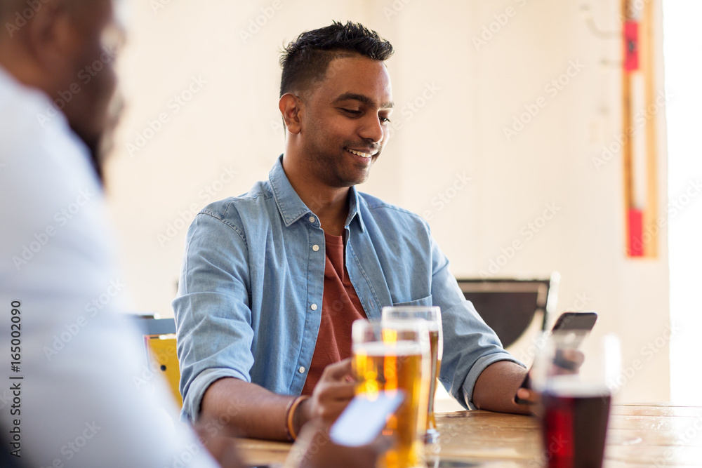 happy male friends drinking beer at bar or pub happy male friends drinking beer at bar or pub