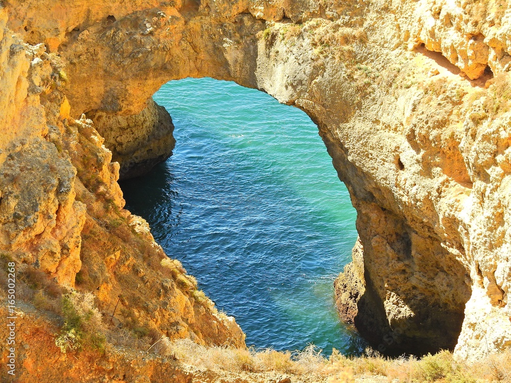 Fototapeta premium Rock hole in the Sea, Lagos, Portugal