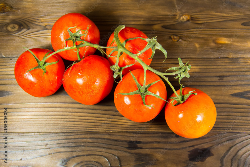 Ripe red tomatoes on wooden table Ripe red tomatoes on wooden table