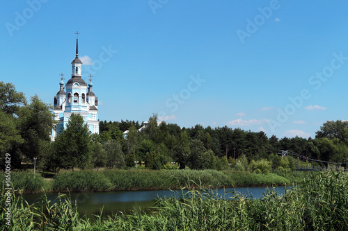 Orthodoxy Christian Church and footbridge on the riverside