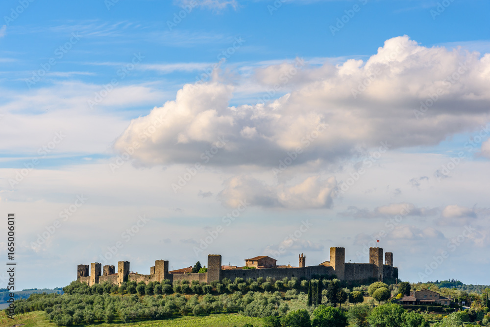 View of the surrounding wall of the beautiful medieval town of Monteriggioni in Tuscany, Italy