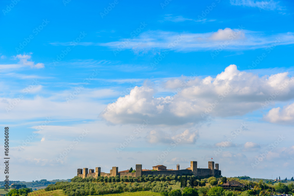 View of the surrounding wall of the beautiful medieval town of Monteriggioni in Tuscany, Italy