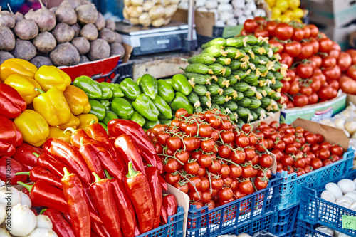market with various colorful fresh fruits and vegetables