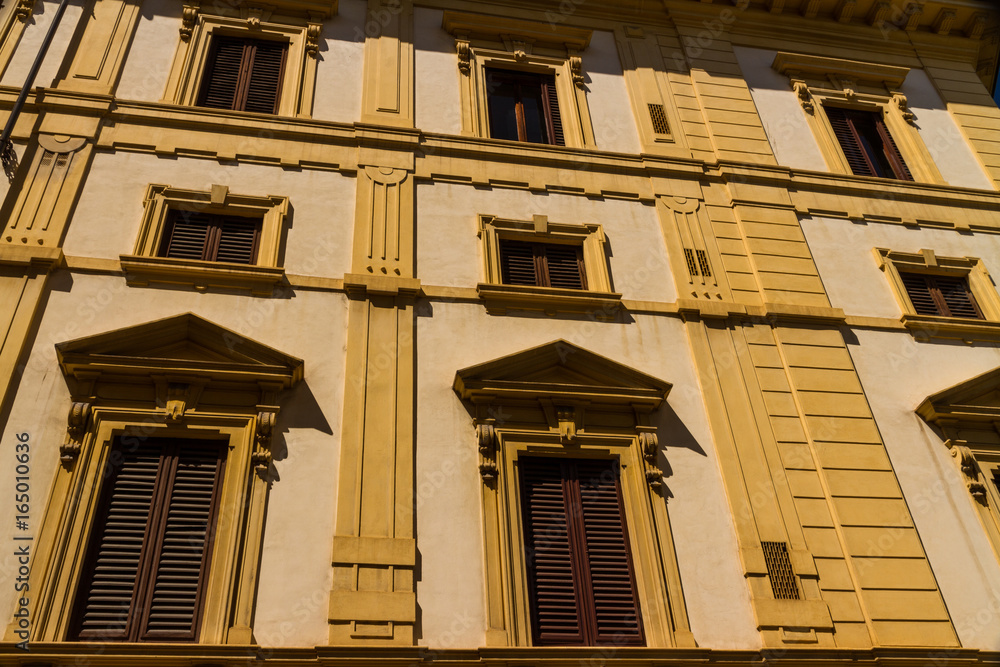 Old residential building front in narrow street, Florence.