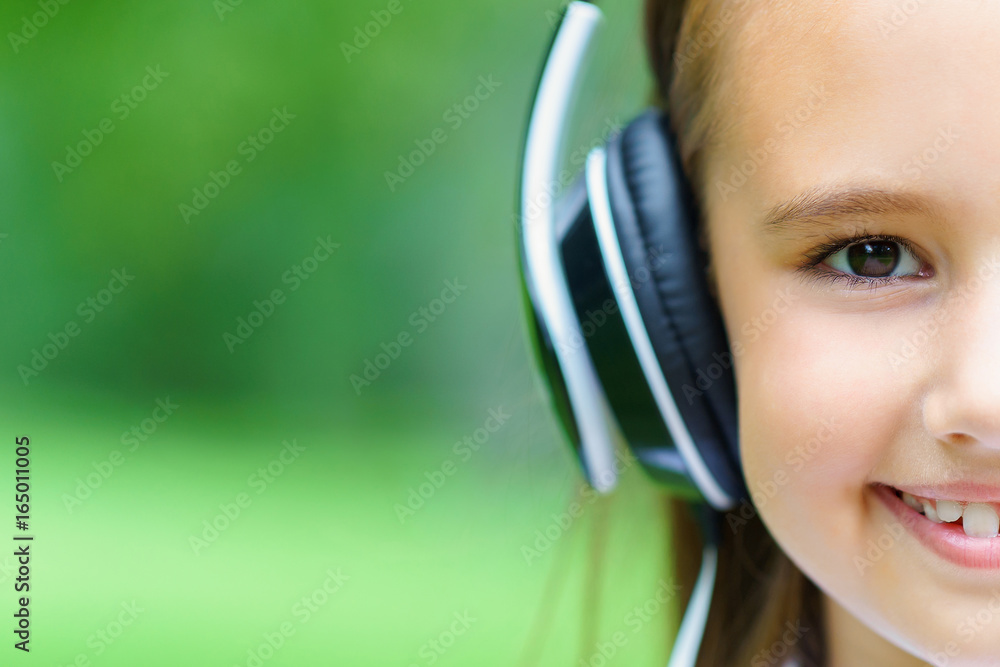 copy space and hulf face of young attractive caucasian girl listening music with professional DJ headphones copy space and hulf face of young attractive caucasian girl listening music with professional DJ headphones