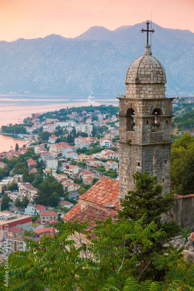 View of old church in St. John's Fortress and Bay of Kotor or Boka Kotorska on background in Montenegro