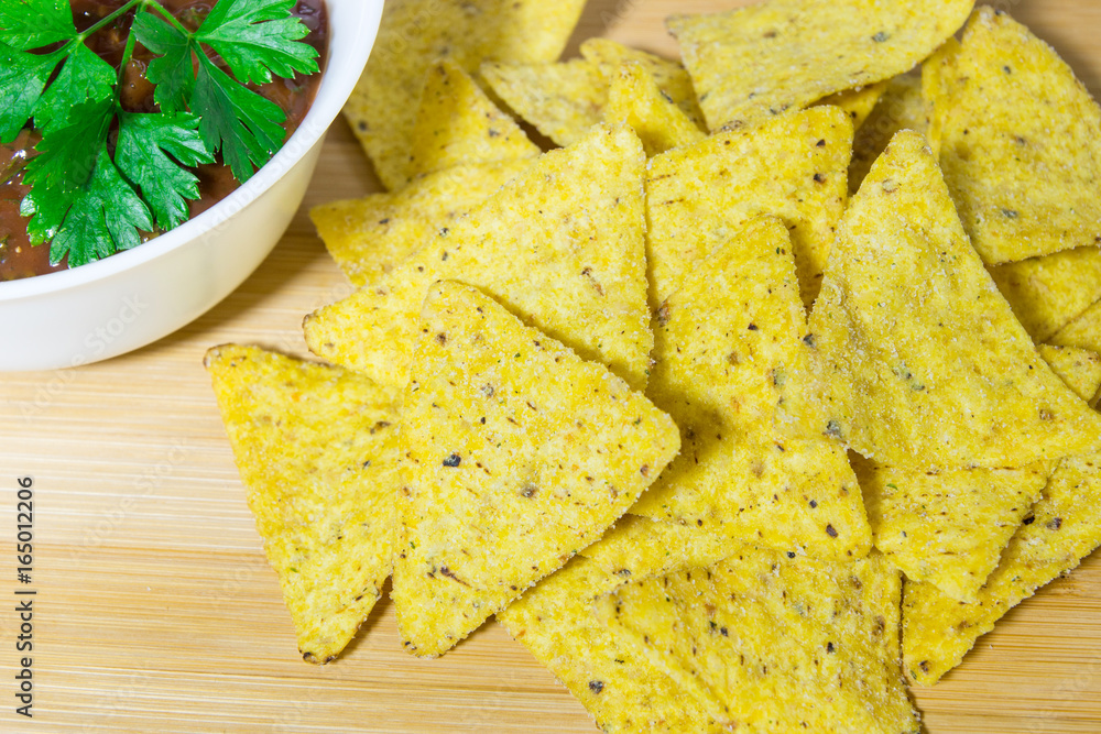 Nachos corn chips with classic tomato salsa. Nachos corn chips with classic tomato salsa.
