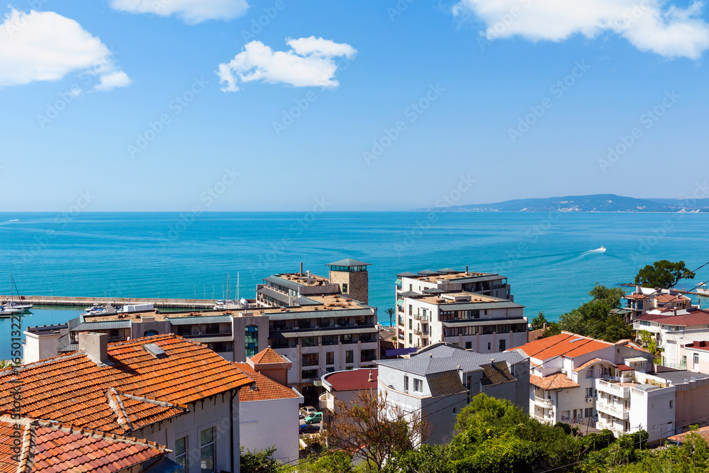 Seascape, view from altitude above houses to the sea with blue, turquoise water in Balchik city, black sea coast in Bulgaria