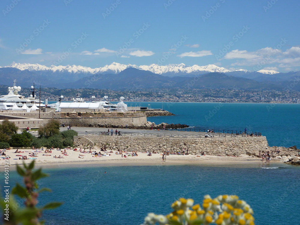 Beach, yacht boats, harbor, mountains and sea in Antibes Cote d'Azur French Riviera France