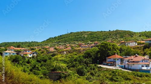 Cityscape of balchik town, houses on green hill, black sea coast in Bulgaria