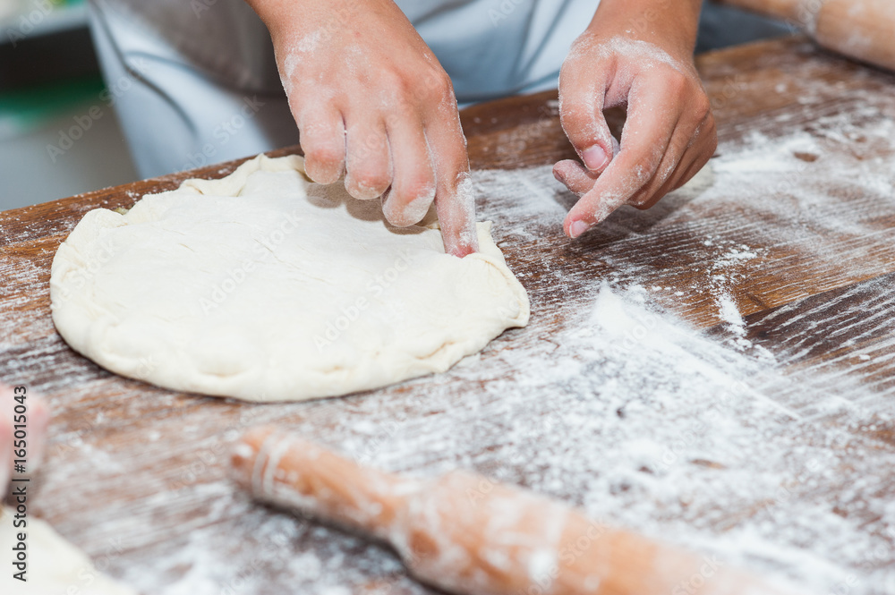 Manufacture of dough products. Hands close up Manufacture of dough products. Hands close up