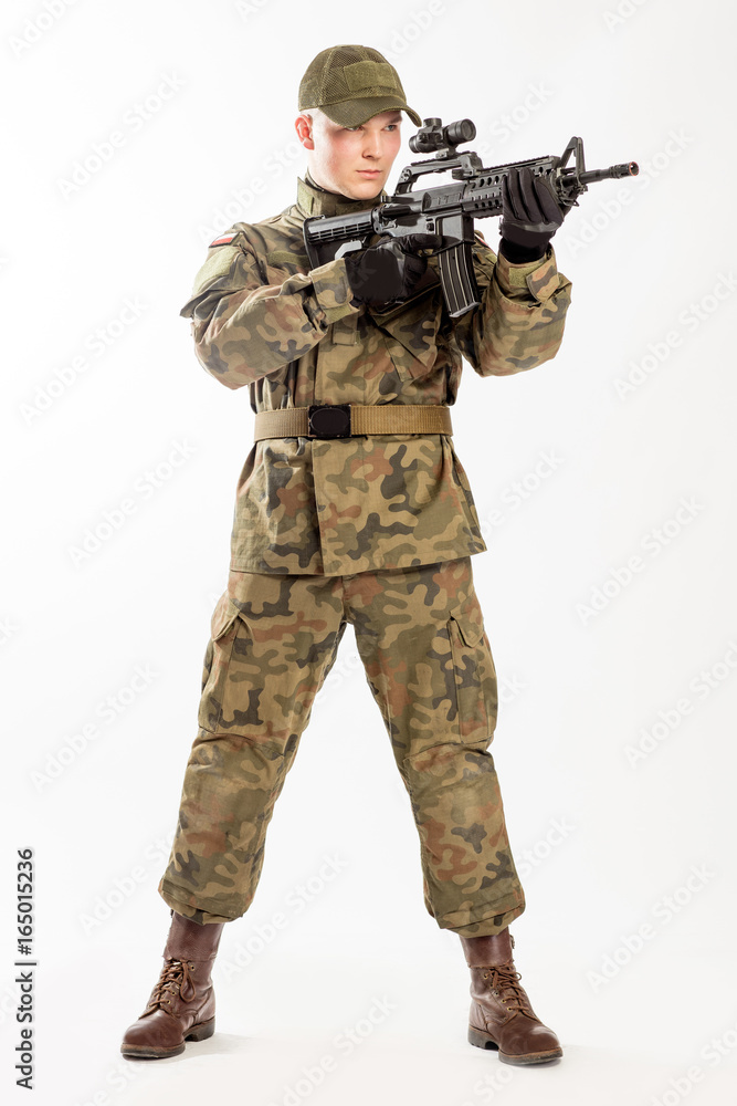 Soldier in military clothes on the white background. Soldier in military clothes on the white background.
