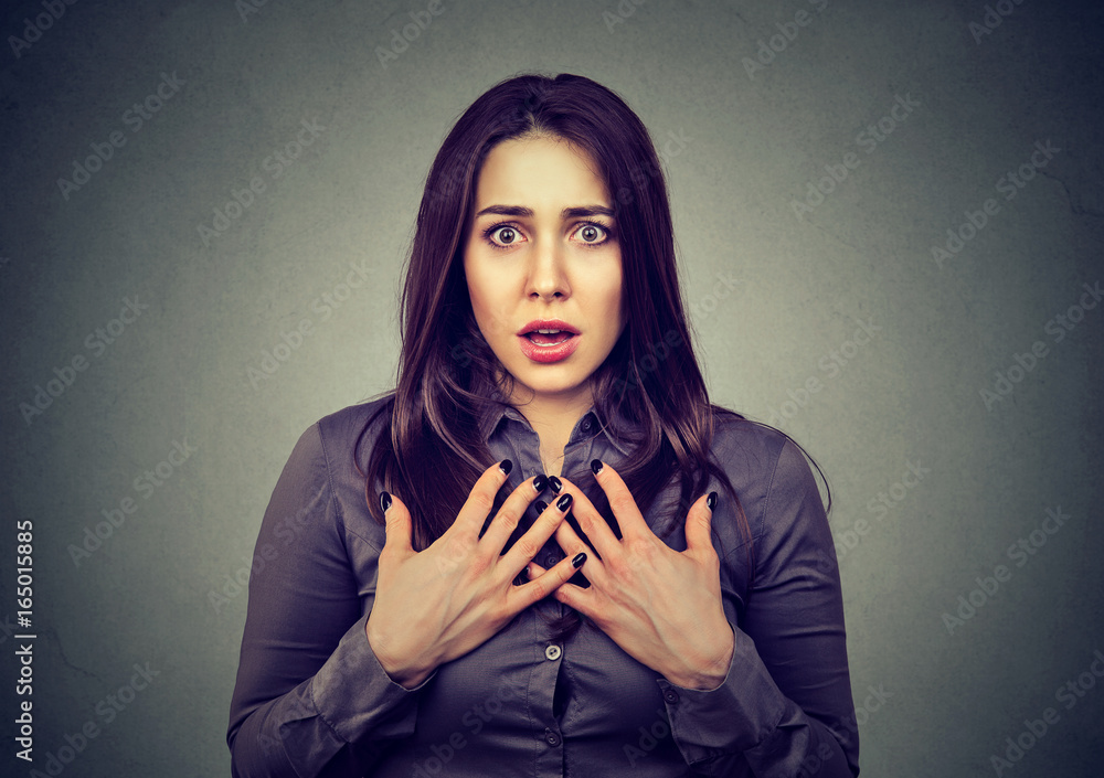 Fotografie Stunned woman looking at camera