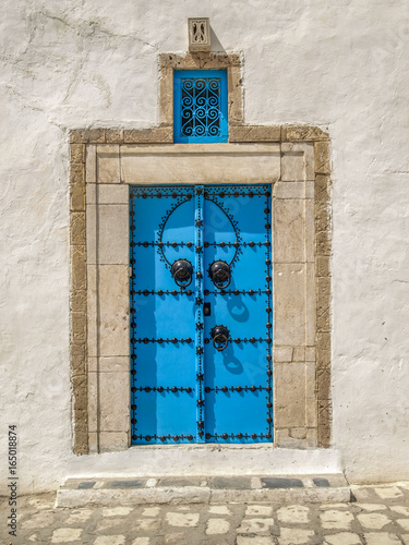 Typical blue door in the Sidi Bou Said city, Tunisia.