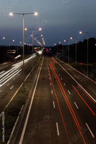 Long exposure of traffic cars lights at night on a highway