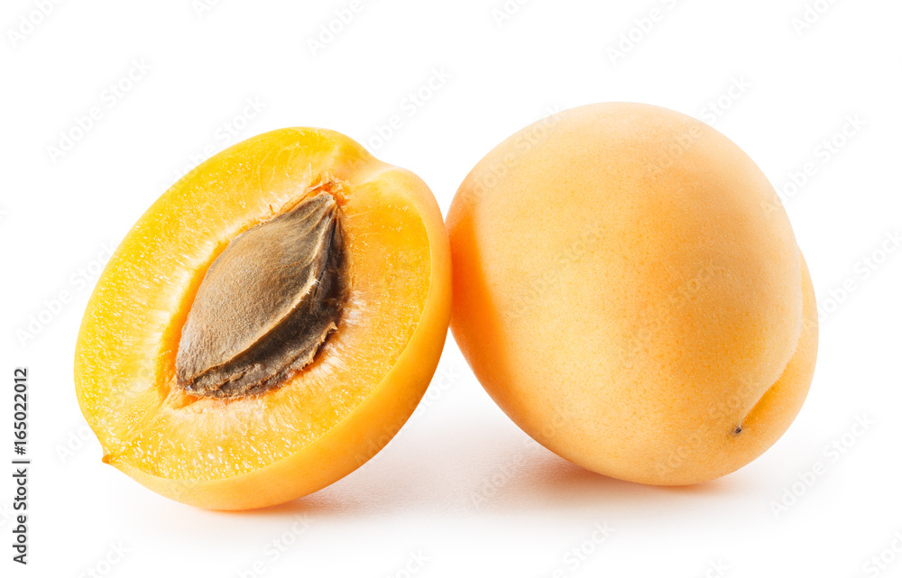 Apricots or peaches isolated on white background