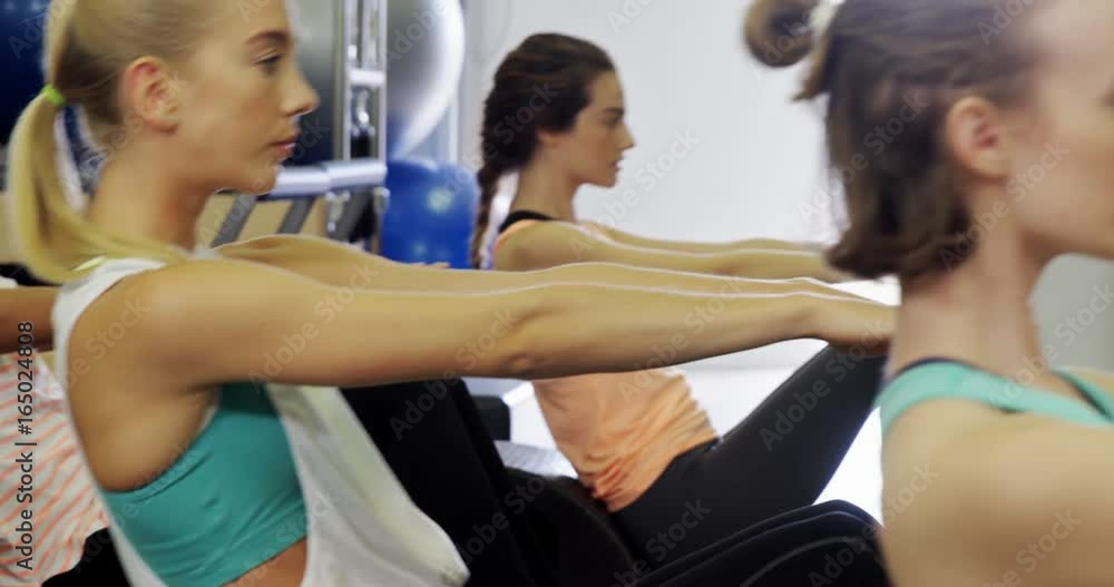 Beautiful women exercising in fitness studio Beautiful women exercising in fitness studio