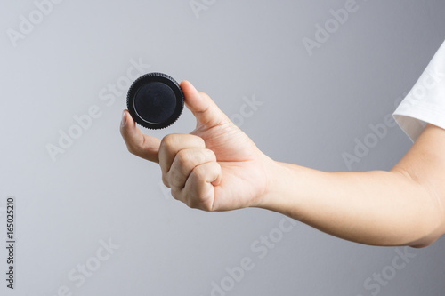 Wallpaper Mural Hand holding lens or camera cap Torontodigital.ca