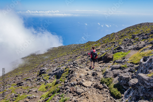 An hiker descending from Mont Pico, Azores, Portugal